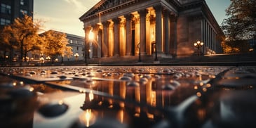 a building with columns and a fountain