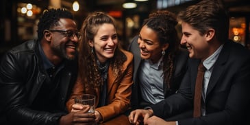 a group of people laughing at a table