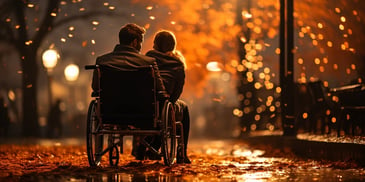 a person and person sitting in a wheelchair