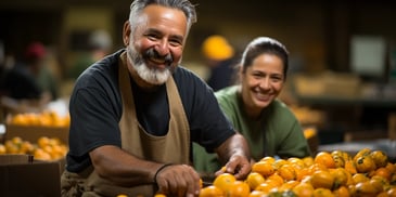 a person and person smiling at a table with tomatoes