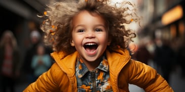 a child with curly hair laughing