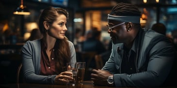 a person and person sitting at a table with drinks