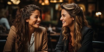 a group of women smiling at each other