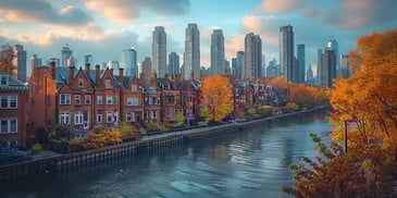 Cityscape with canal and autumn trees.