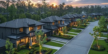 Modern suburban homes at sunset.