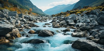 a river flowing through a rocky valley