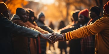 a group of people holding hands