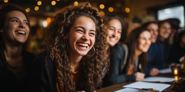 a person laughing at a table