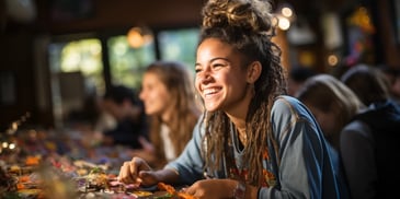 a person smiling at a table