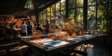 a group of people sitting in a room with a table with glass domes