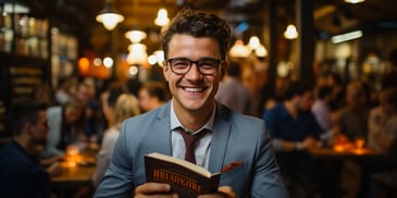 a person in a suit and tie holding a book